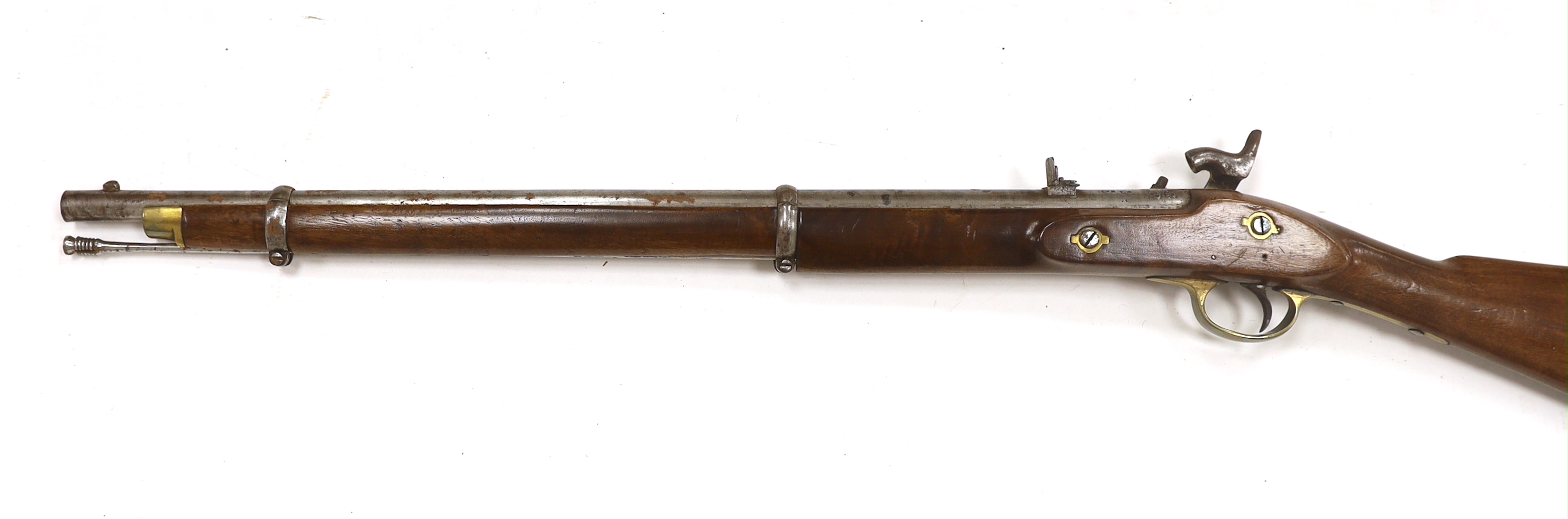A two band percussion Military carbine of Indian use, regulation brass mounts, fold leaf rear sight, regulation brass mount, lock with Indian marks and also crowned VR, barrel 66.2cm